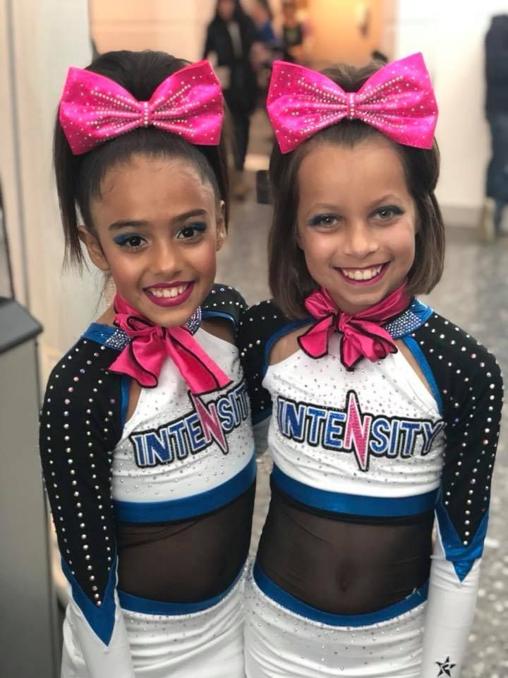 A group of cheerleaders are performing on a stage.