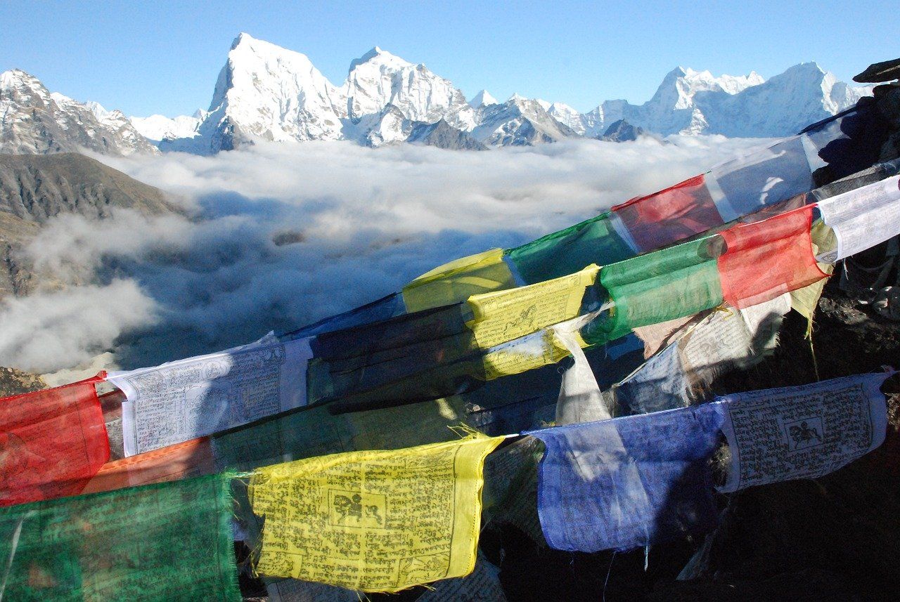 Snow capped mountains with a line of tibetan streamers in foreground
