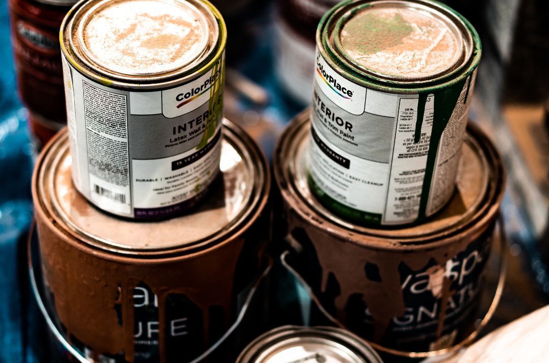 can you put paint cans in a dumpster