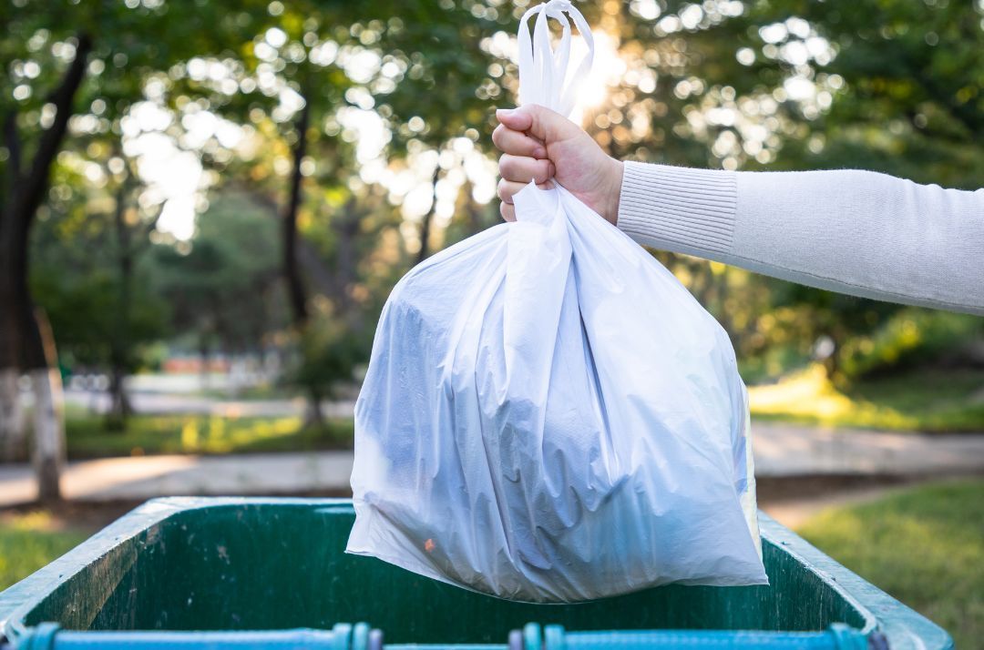 is it illegal to throw trash in someone else's trash can