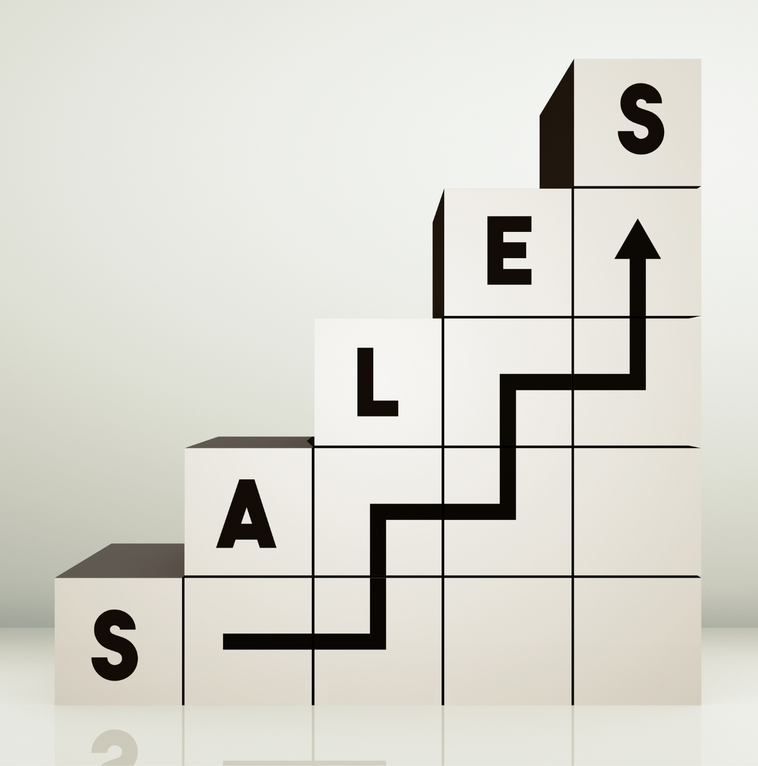 A staircase made of blocks with the word sales on them