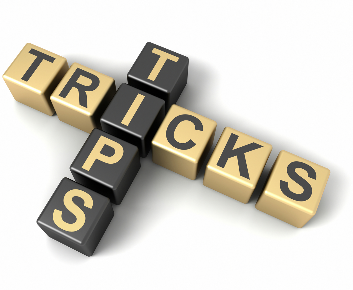 The words tips and tricks in scrabble style layout overlapping at the 