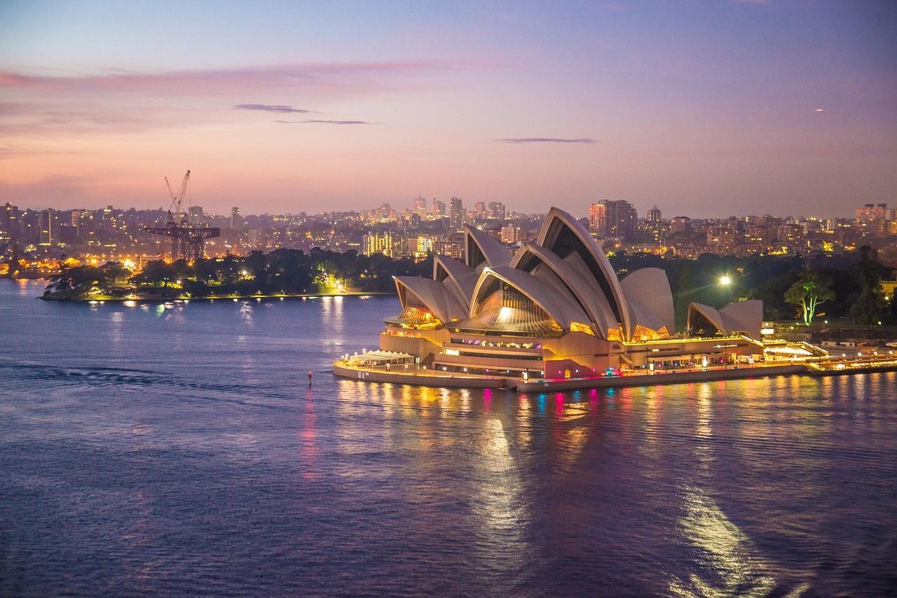 An aerial view of the opera house in sydney at night.