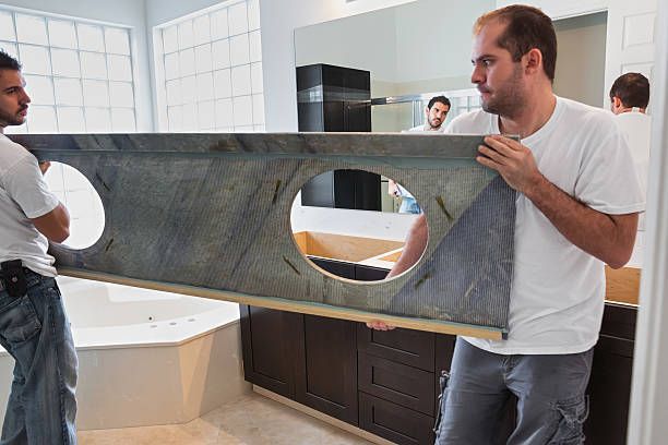 Worker Installing Granite In The Bathroom - Albuquerque, NM - Sandia Marble