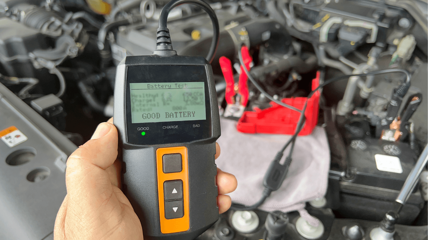 a mechanic checking battery function with diagnostic software
