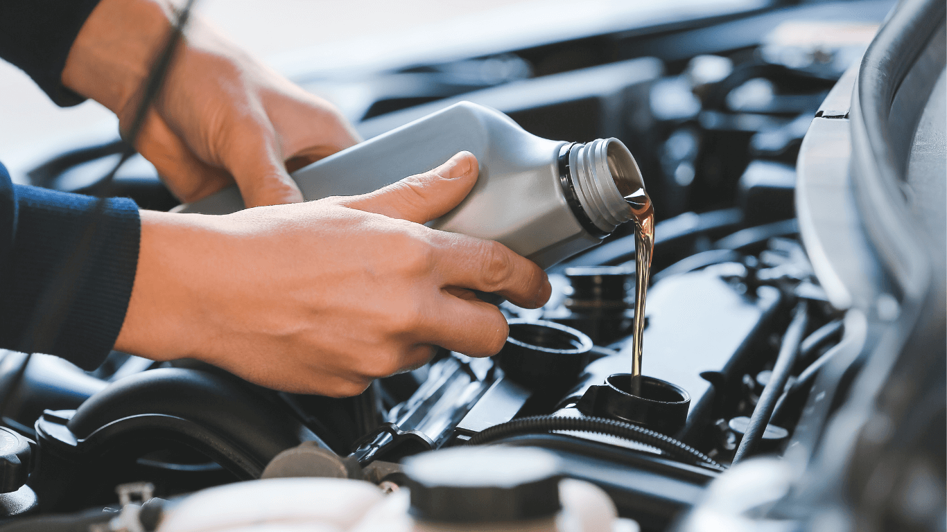 a mechanic doing an oil change
