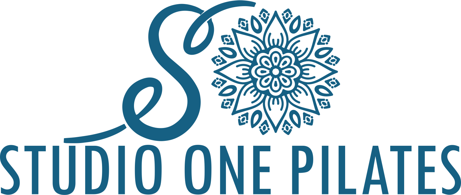 The logo for studio one pilates has a blue flower in the center.
