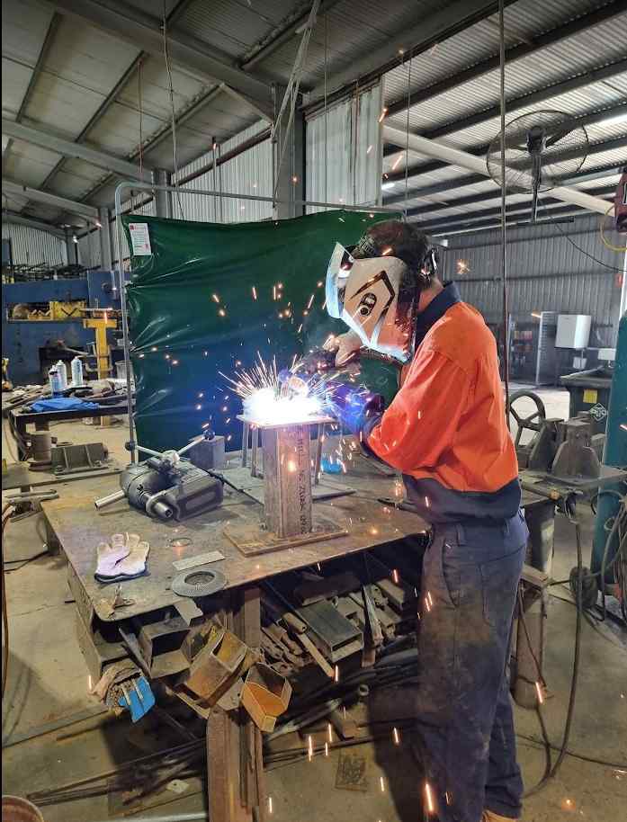 Welding a Metal Post on Work Bench - Metal Fabricators in Lismore, NSW