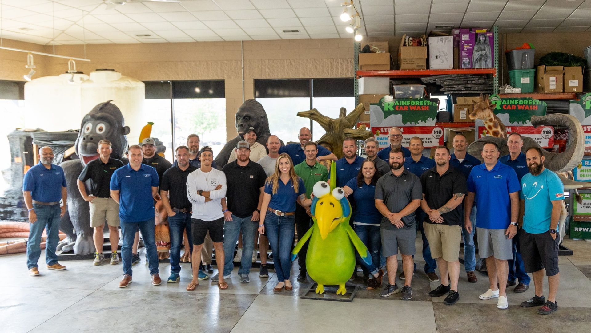 A group of people standing next to each other in a room.