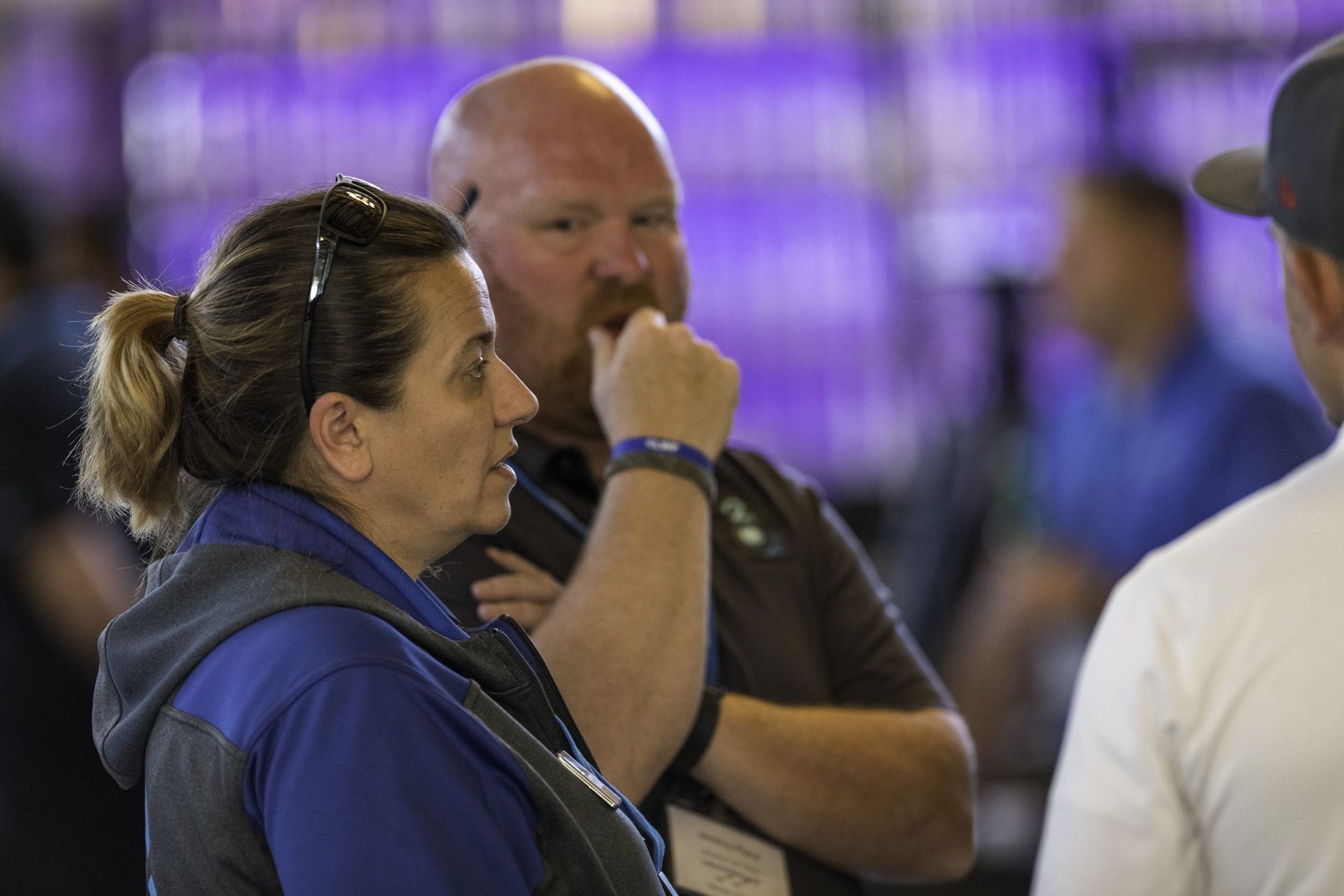 A man and a woman are talking to each other in a room.