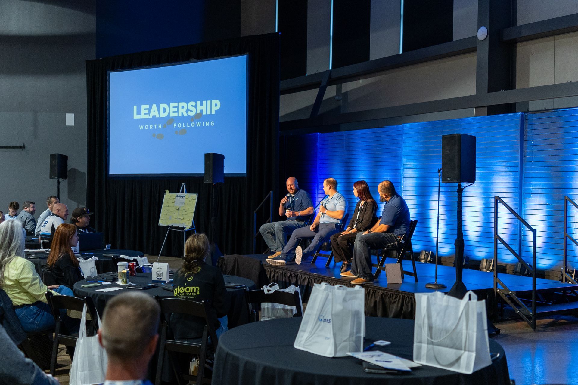 Panel discussion on a stage with