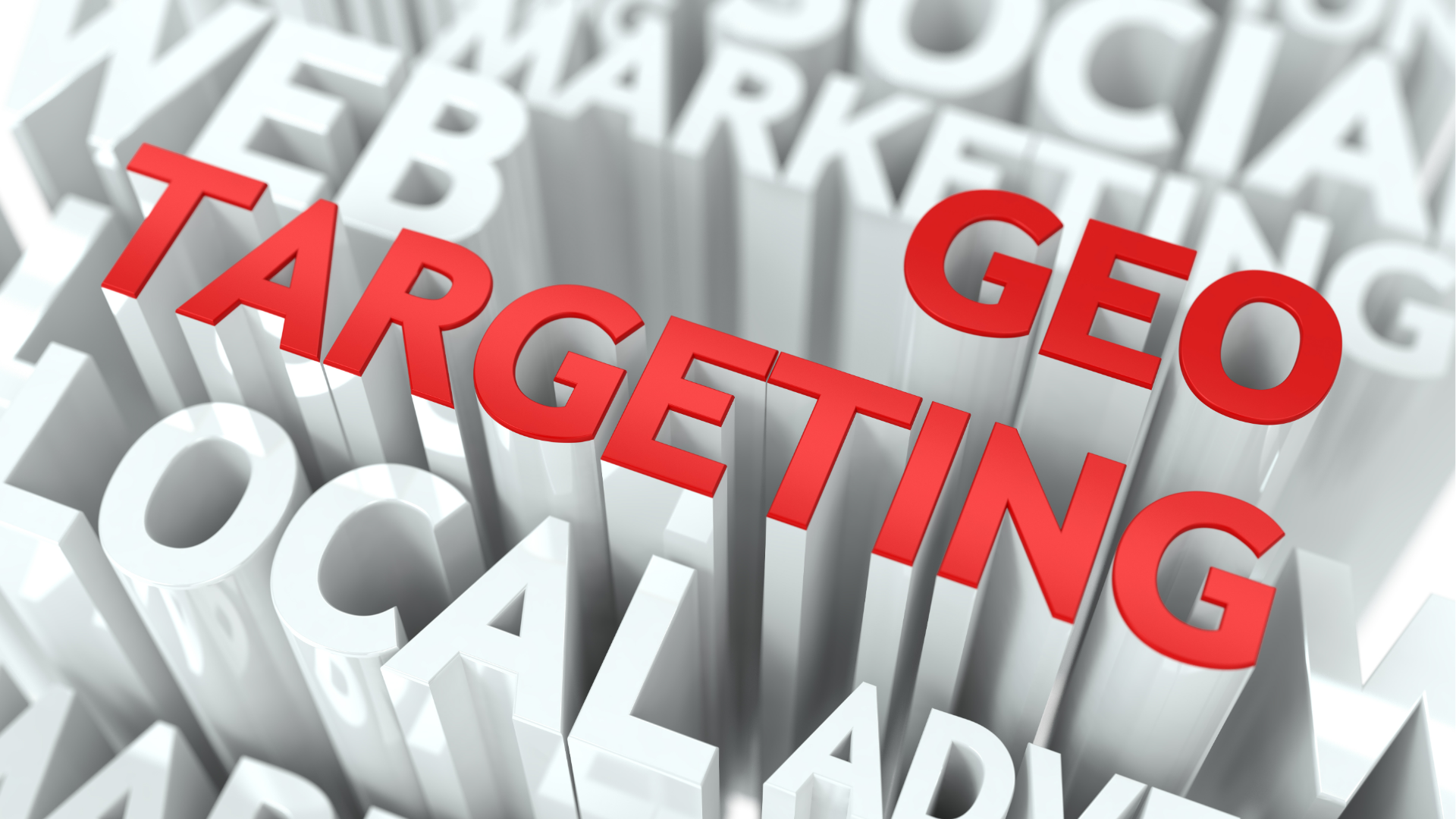 Person typing on laptop, viewing financial charts and pie chart. Phone rests beside the laptop on wooden table.