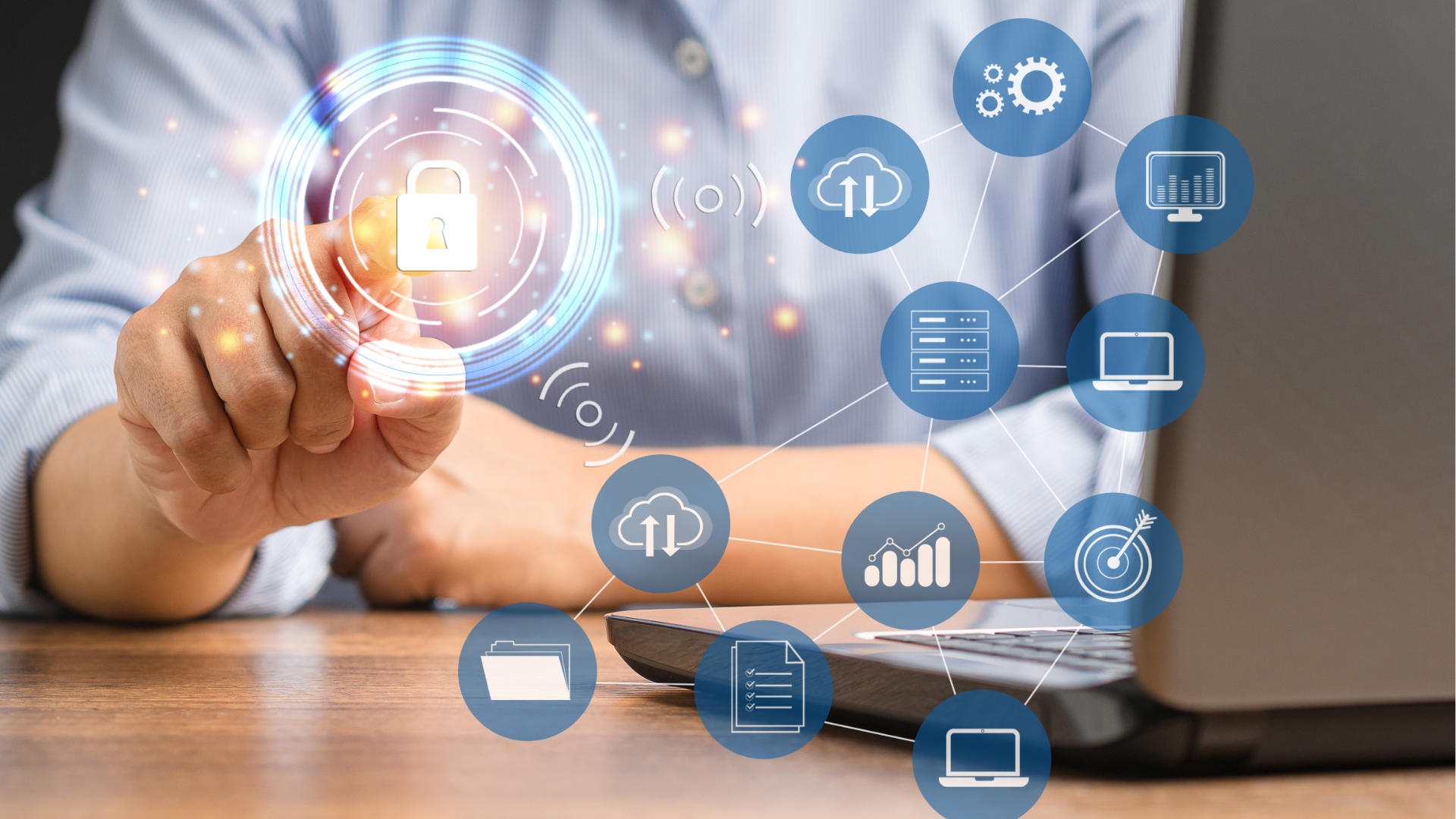 Person typing on laptop, viewing financial charts and pie chart. Phone rests beside the laptop on wooden table.