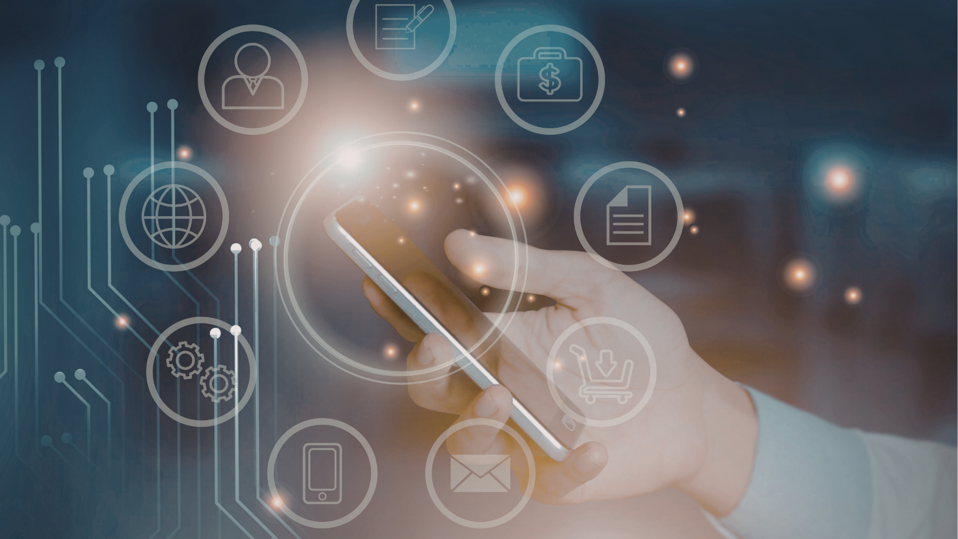 People at a table looking at laptops. They are smiling and working in a modern office.