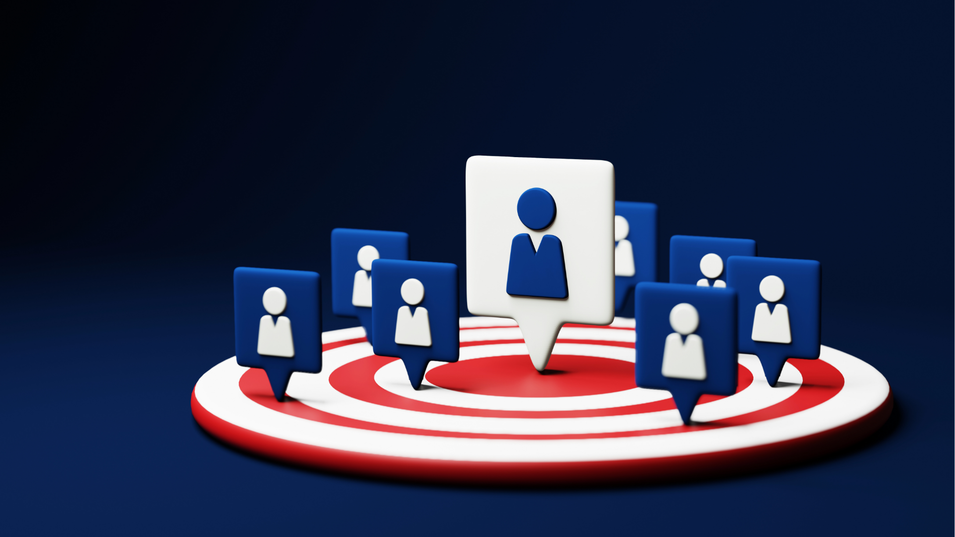 People at a table looking at laptops. They are smiling and working in a modern office.