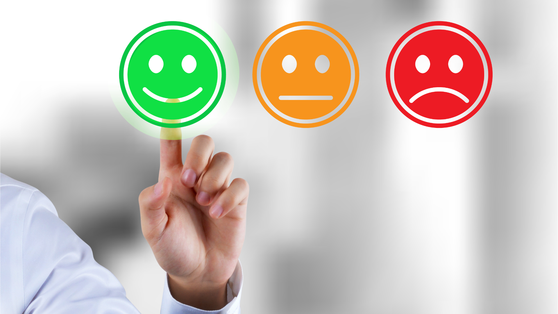 Person typing on laptop, viewing financial charts and pie chart. Phone rests beside the laptop on wooden table.