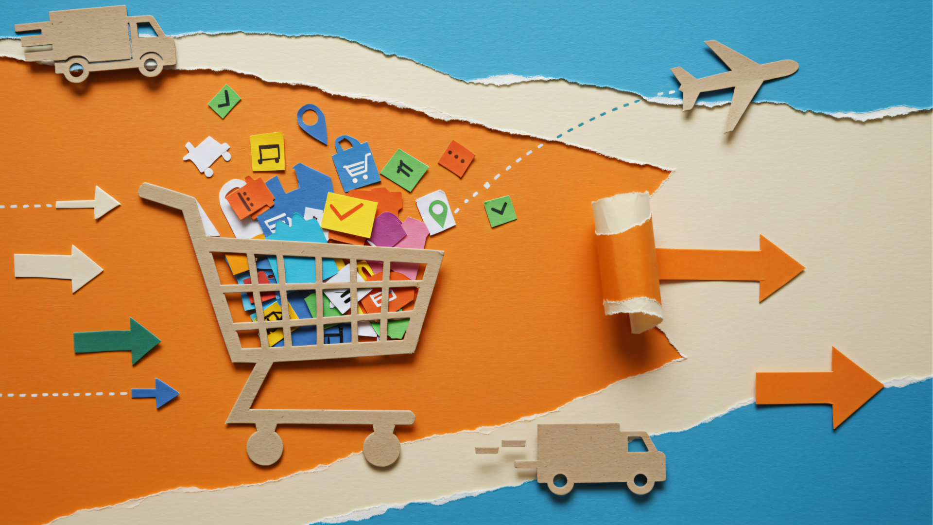 Man with glasses, working on a laptop at a desk with a coffee mug and papers.