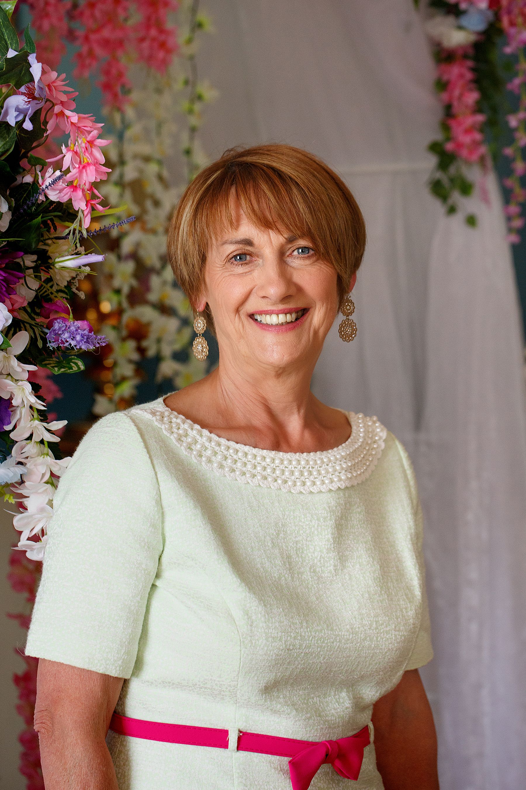 Marian Dooley Celebrant holding a book