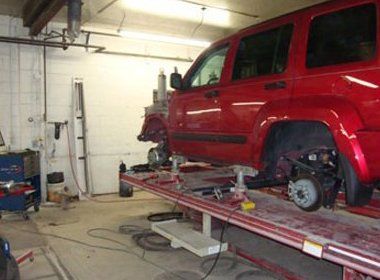 Repairing a Red SUV — Findlay, OH — Findlay Body Repair Co. LTD