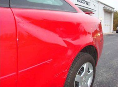 Red Car with Dent  — Findlay, OH — Findlay Body Repair Co. LTD