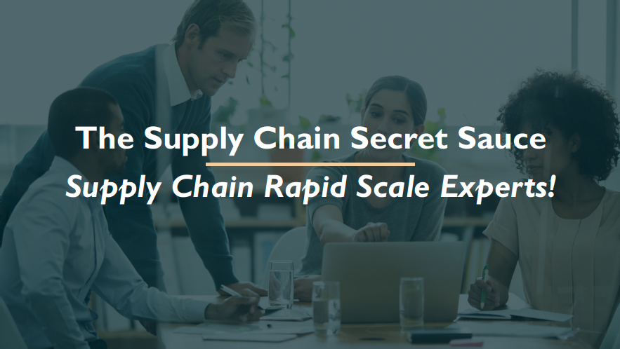 A group of people are sitting around a table looking at a laptop.