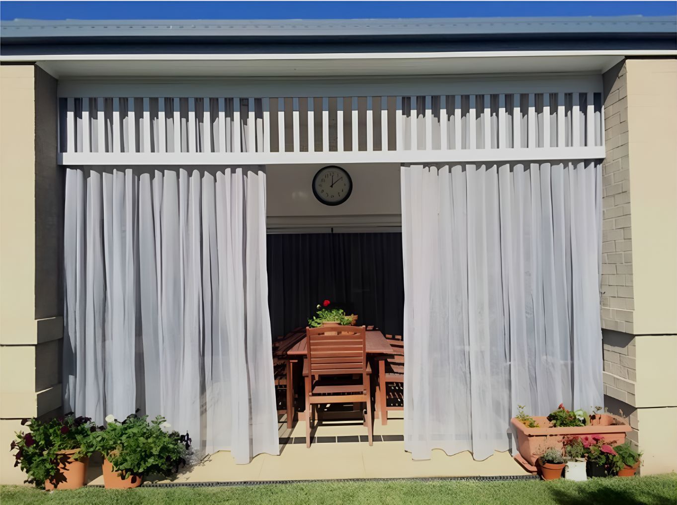 Patio With White Curtains and Clock on the Wall — Newcastle Curtains And Blinds In Warners Bay, NSW