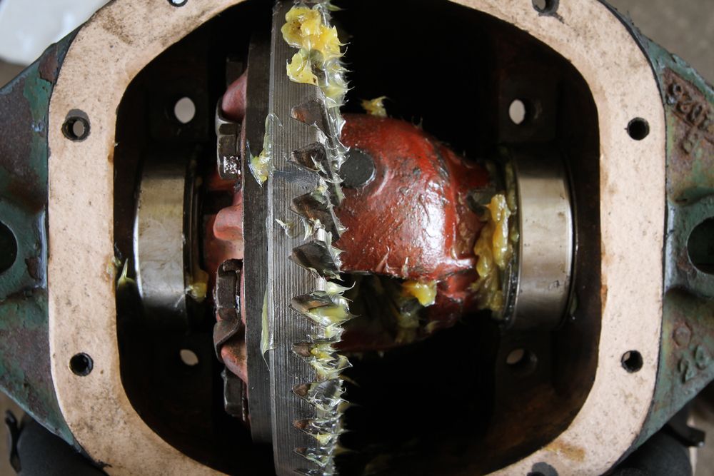 Showing Broken Gears Covered in Grease — North Queensland Independant Fuel Services in Mackay, QLD