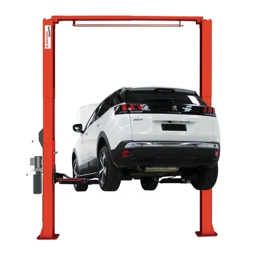 Red Car Lift Supporting a White Suv in a Garage — North Queensland Independant Fuel Services in Slade Point, QLD