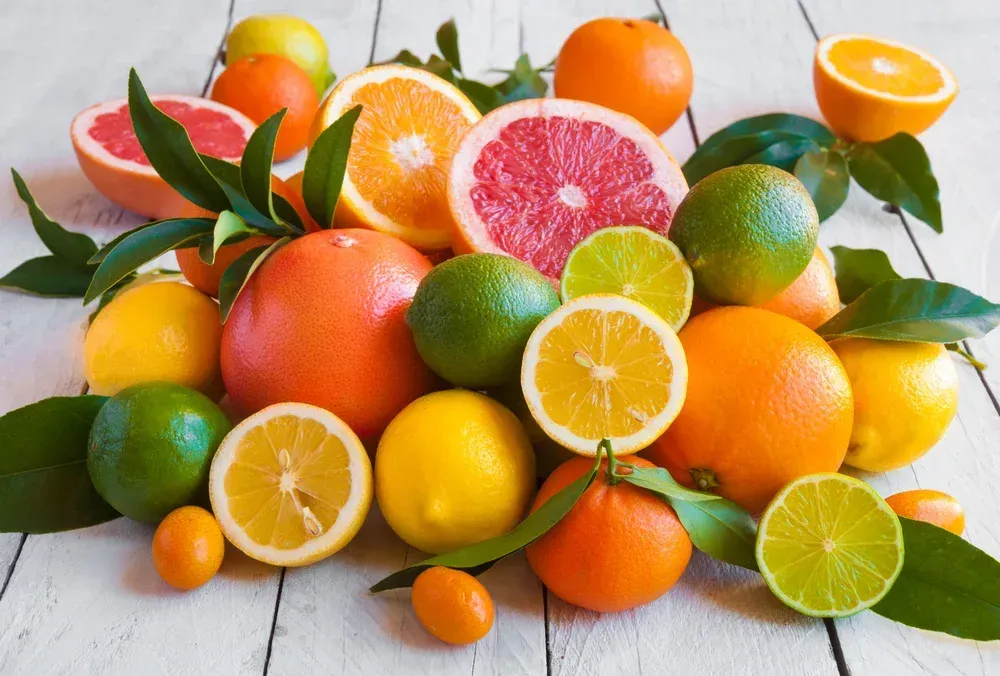 Citrus Fruits Arranged on a White Wooden Surface — North Queensland Independant Fuel Services in Slade Point, QLD