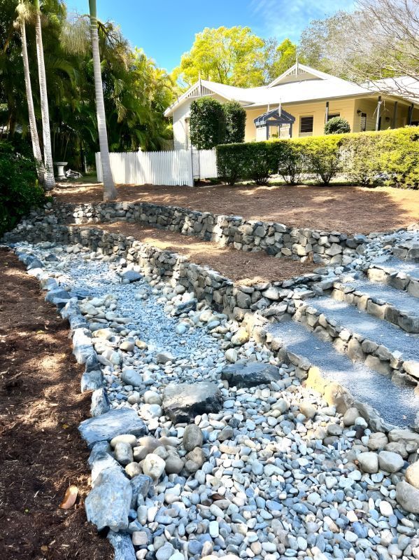 A House With A Lot Of Rocks In Front Of It — Creative Landscapes Coffs Harbour In Emerald Beach, NSW