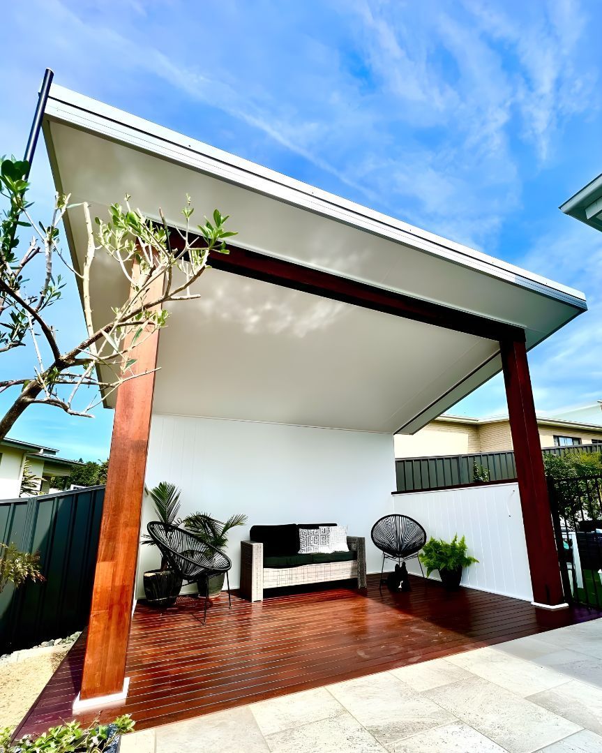 There Is A Patio With A Couch And Chairs Under A Roof — Creative Landscapes Coffs Harbour In Emerald Beach, NSW