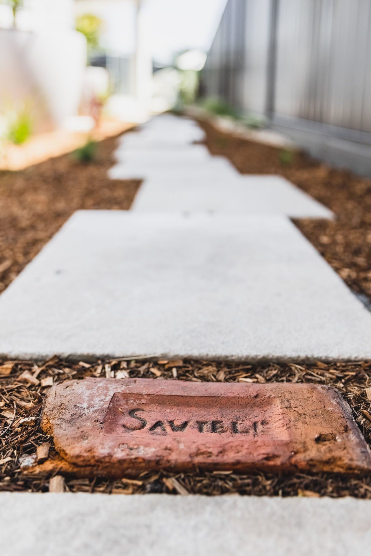 A Brick With The Word Save On It Is On The Sidewalk — Creative Landscapes Coffs Harbour In Korora, NSW