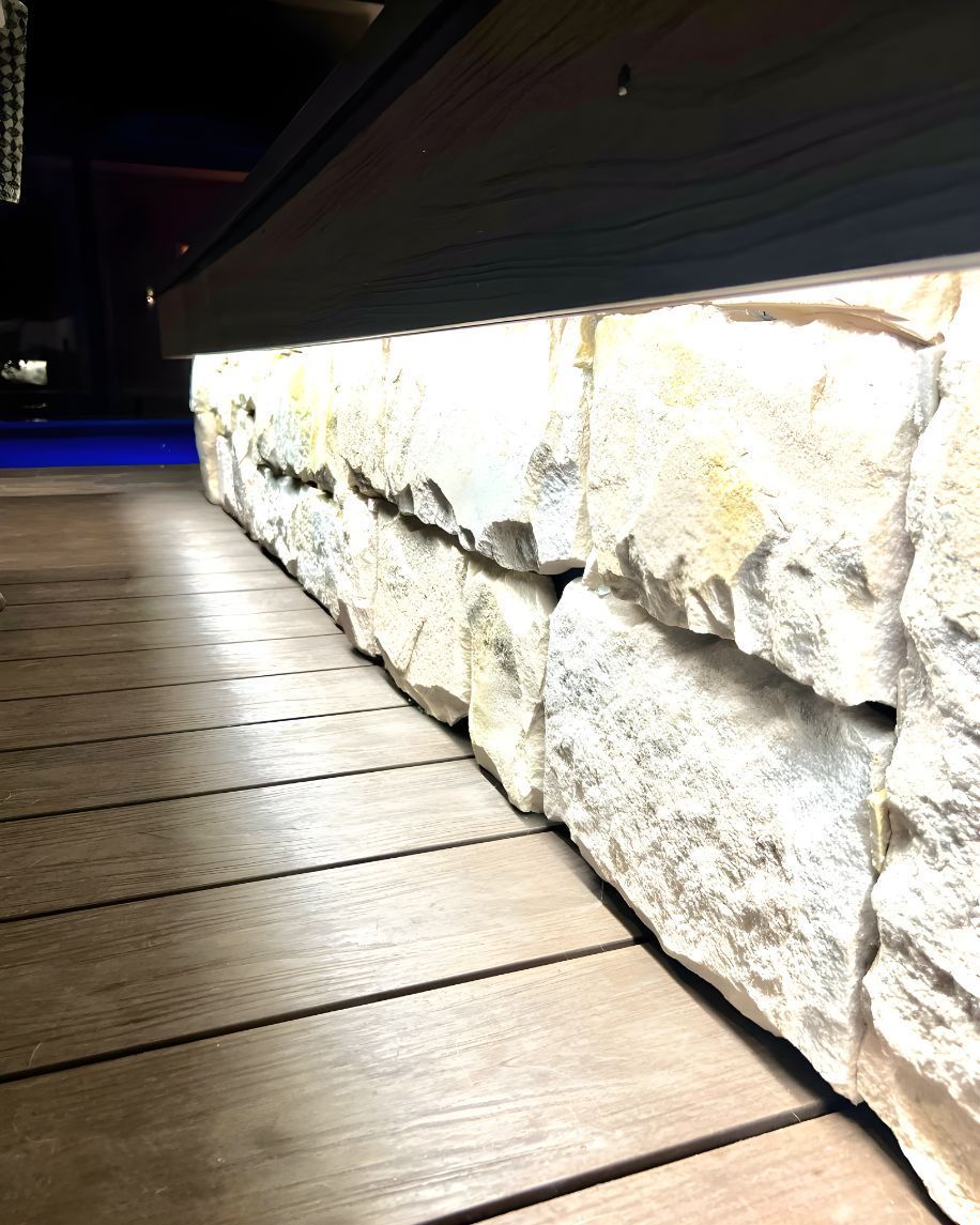 A Row Of Rocks Sitting On Top Of A Wooden Deck — Creative Landscapes Coffs Harbour In Woolgoolga, NSW
