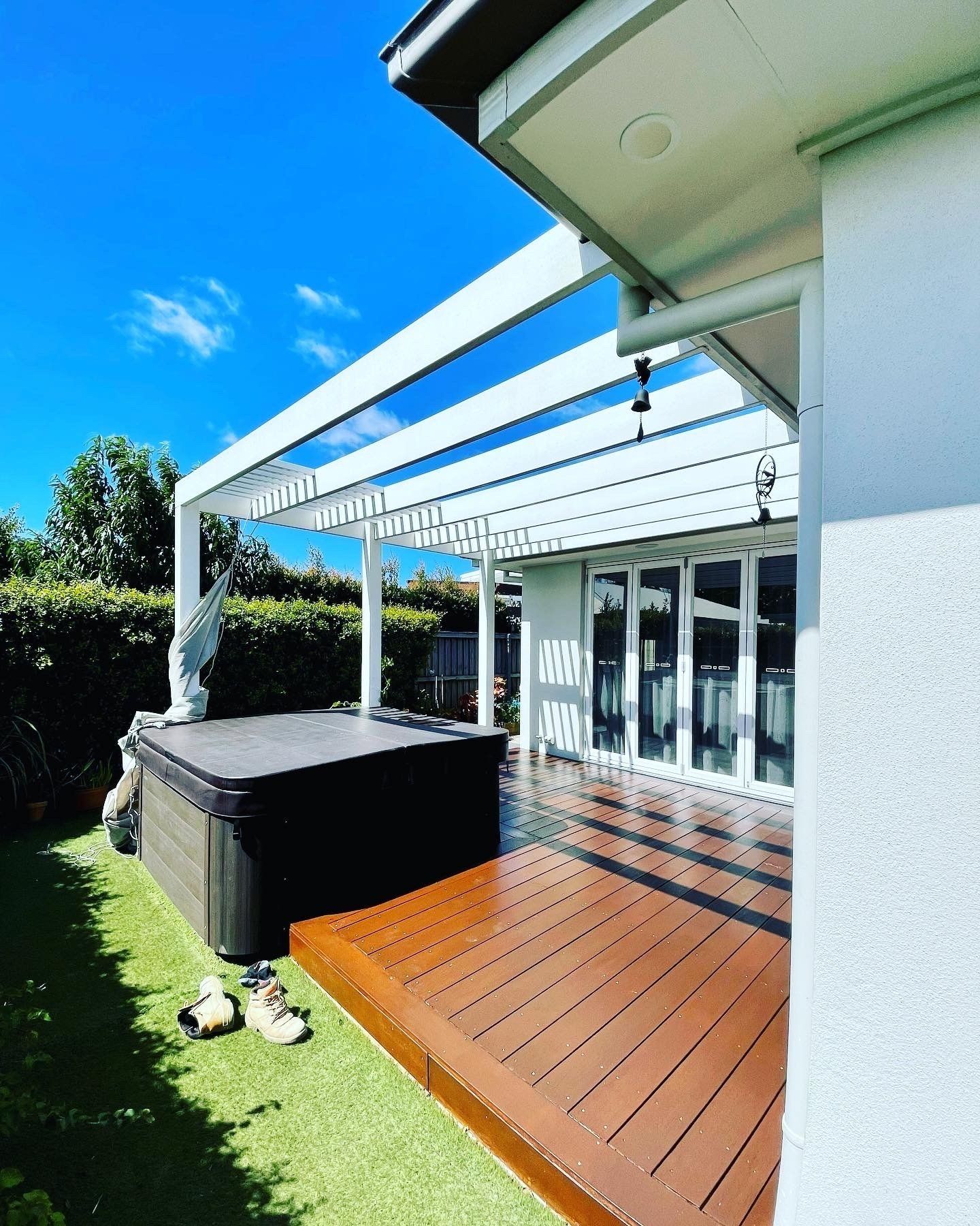 A House With A Hot Tub And A Wooden Deck — Creative Landscapes Coffs Harbour In Sawtell, NSW