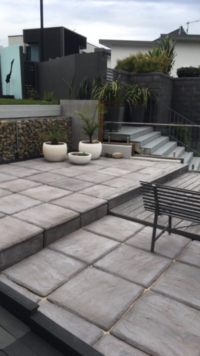 A Patio With Stairs And Potted Plants On It — Creative Landscapes Coffs Harbour In Korora, NSW