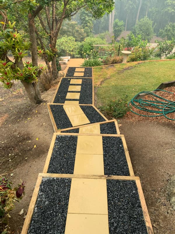 A Walkway With A Hose On The Side Of It In A Garden — Creative Landscapes Coffs Harbour In Korora, NSW