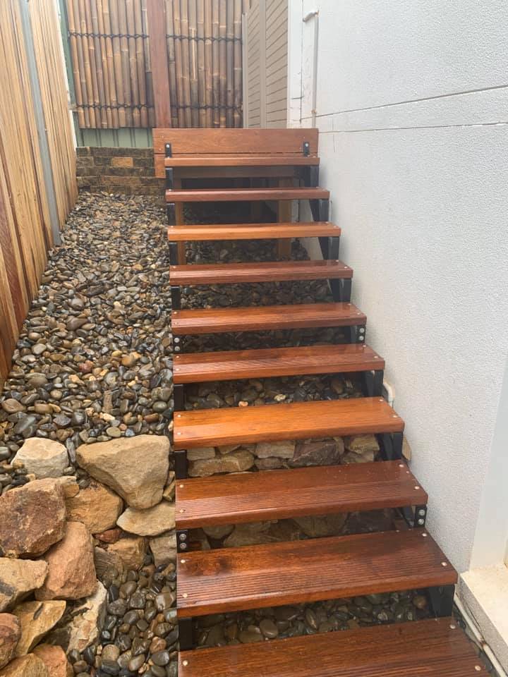 A Set Of Wooden Stairs Leading Up To A House — Creative Landscapes Coffs Harbour In Korora, NSW