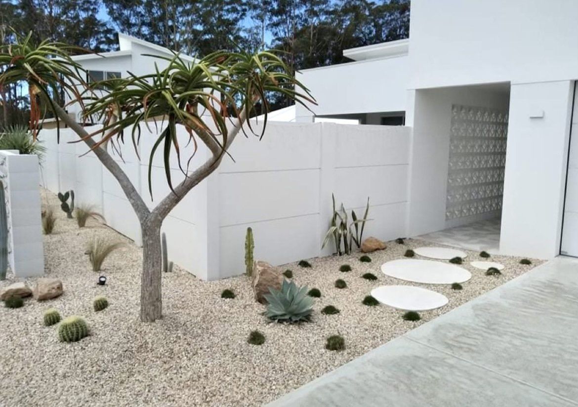 A White House With A Tree In Front Of It — Creative Landscapes Coffs Harbour In Korora, NSW