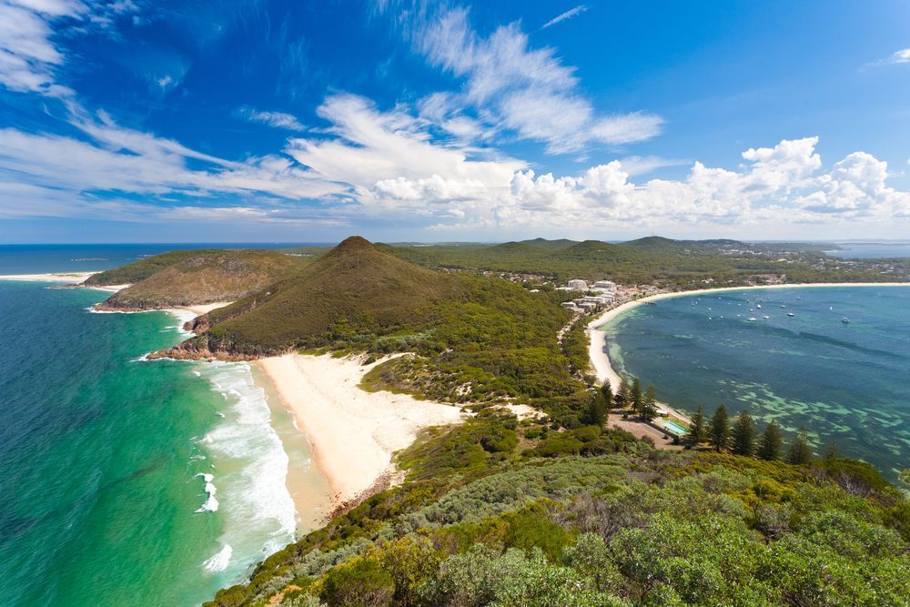 An Aerial View Of A Beach And Ocean On A Sunny Day — Creative Landscapes Coffs Harbour In Korora, NSW