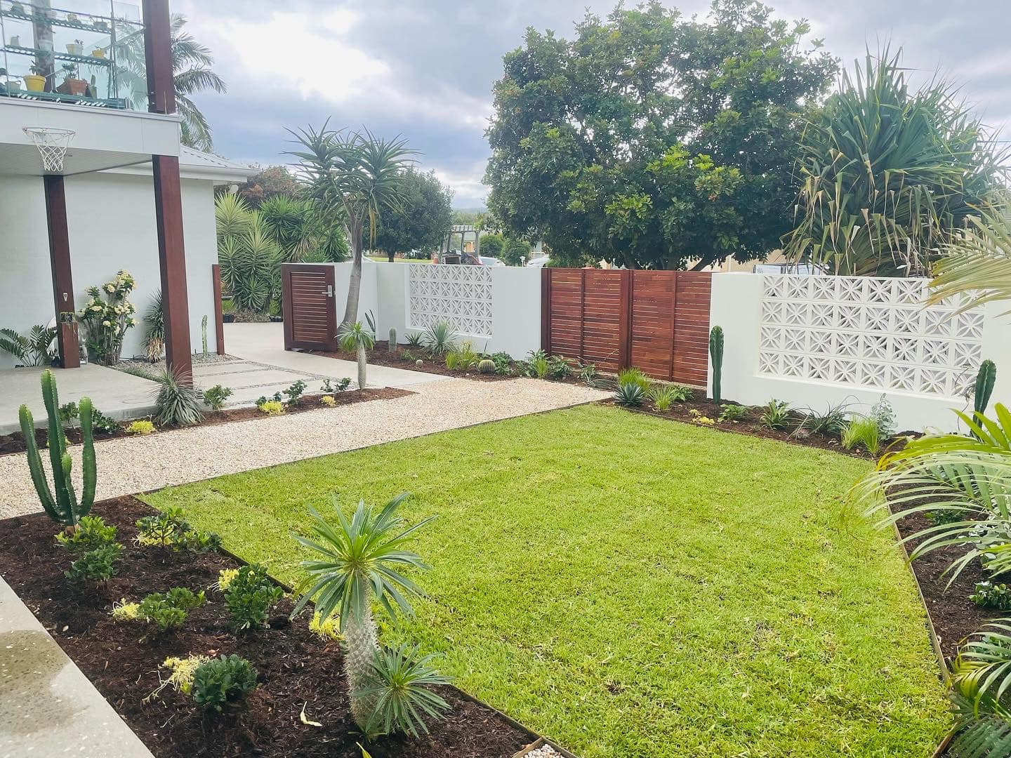 A Large Lush Green Lawn In Front Of A White House — Creative Landscapes Coffs Harbour In Korora, NSW
