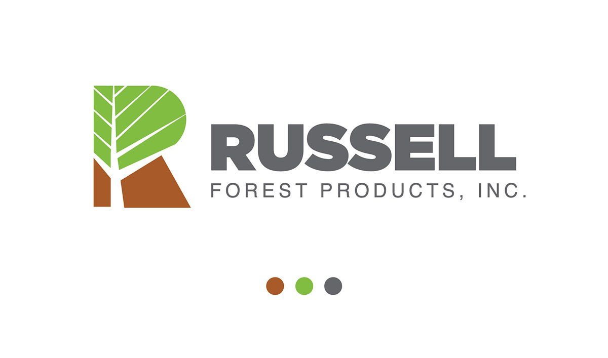 The logo for russell forest products inc. has a tree on it.