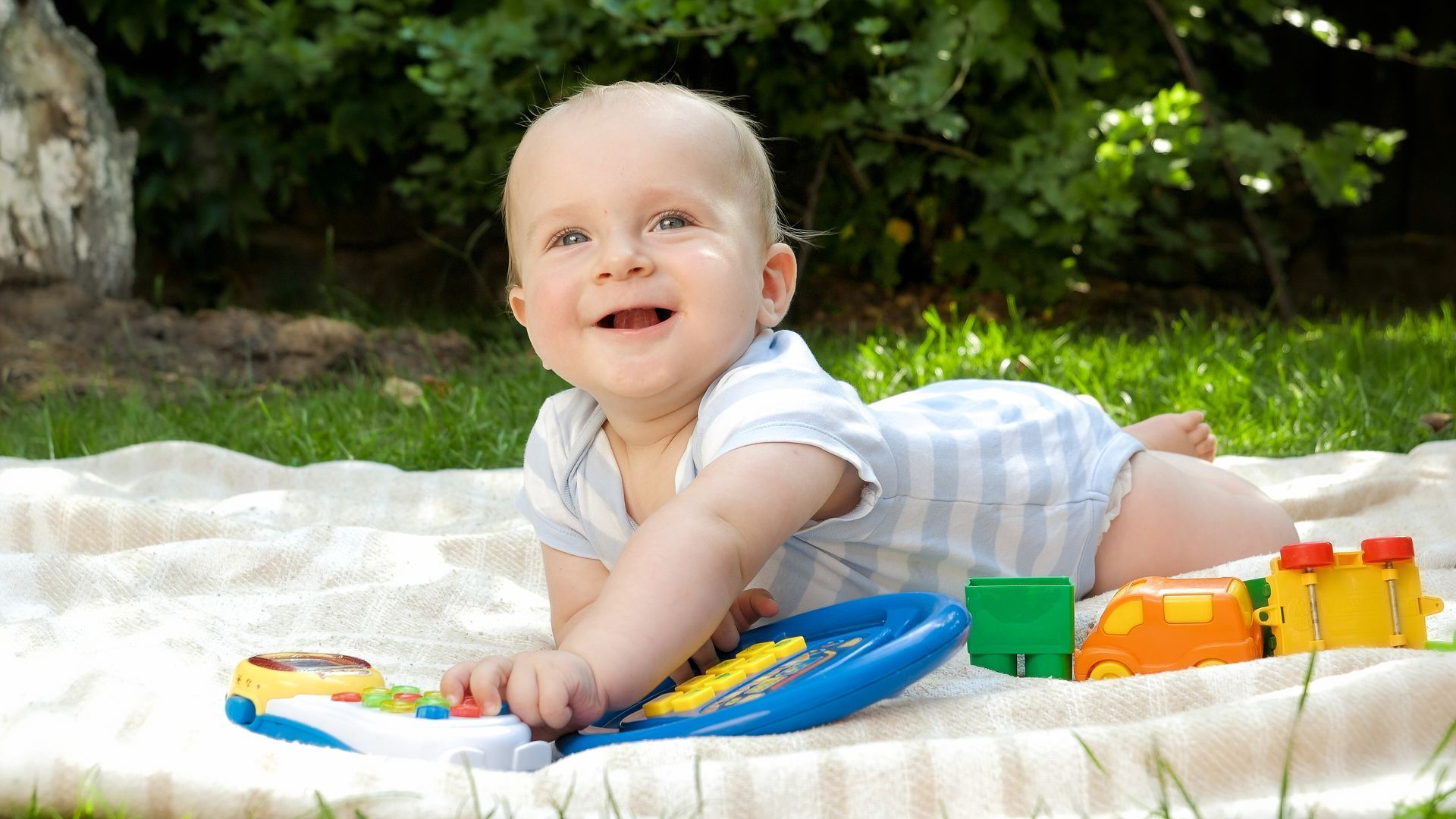 Baby playing on  blanket