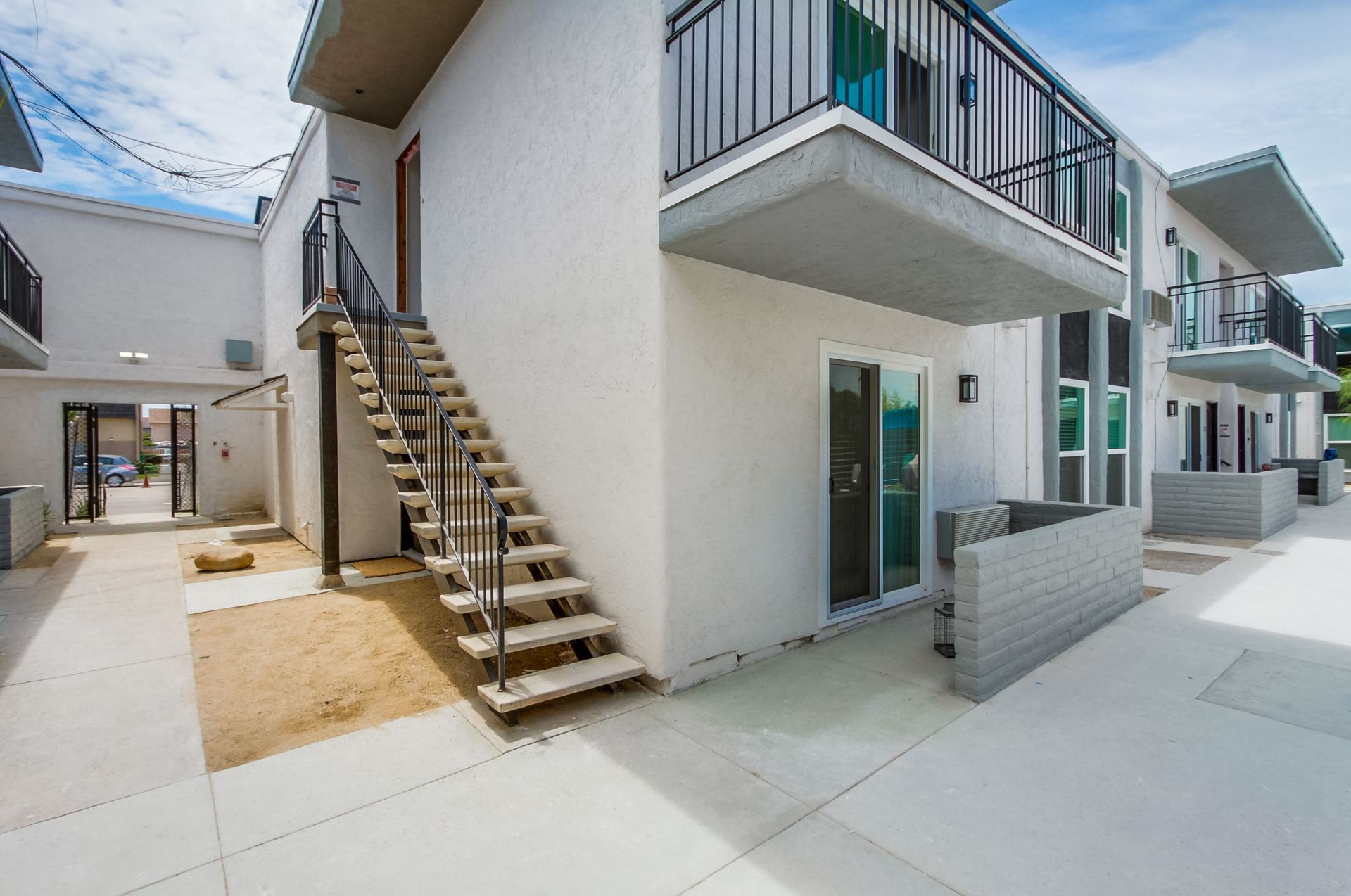 Photo showing stairs leading up to an apartment front door