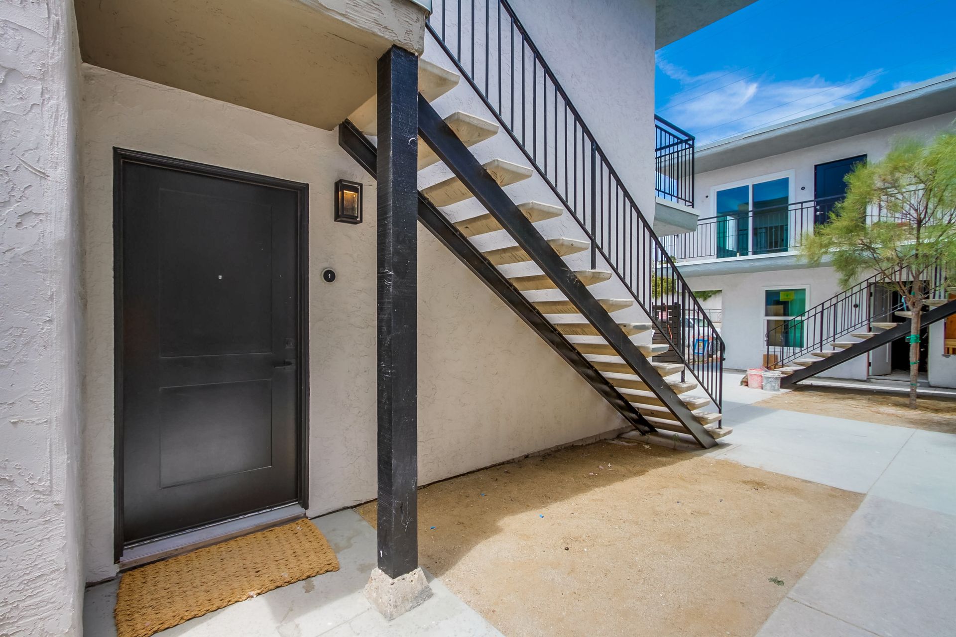 Photo showing an entrance to a downstairs apartment