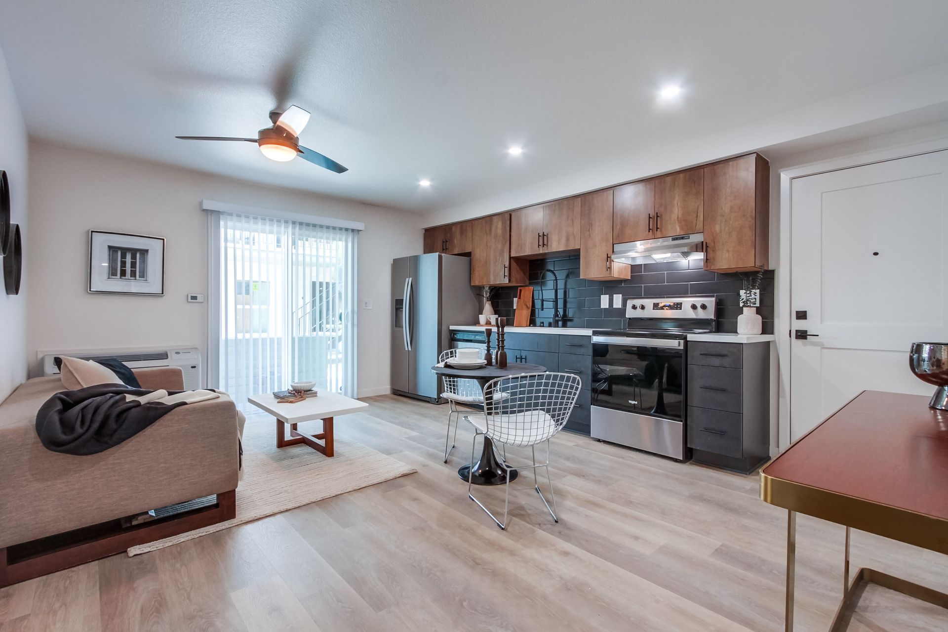 Photo showing living room seamlessly integrated into the kitchen