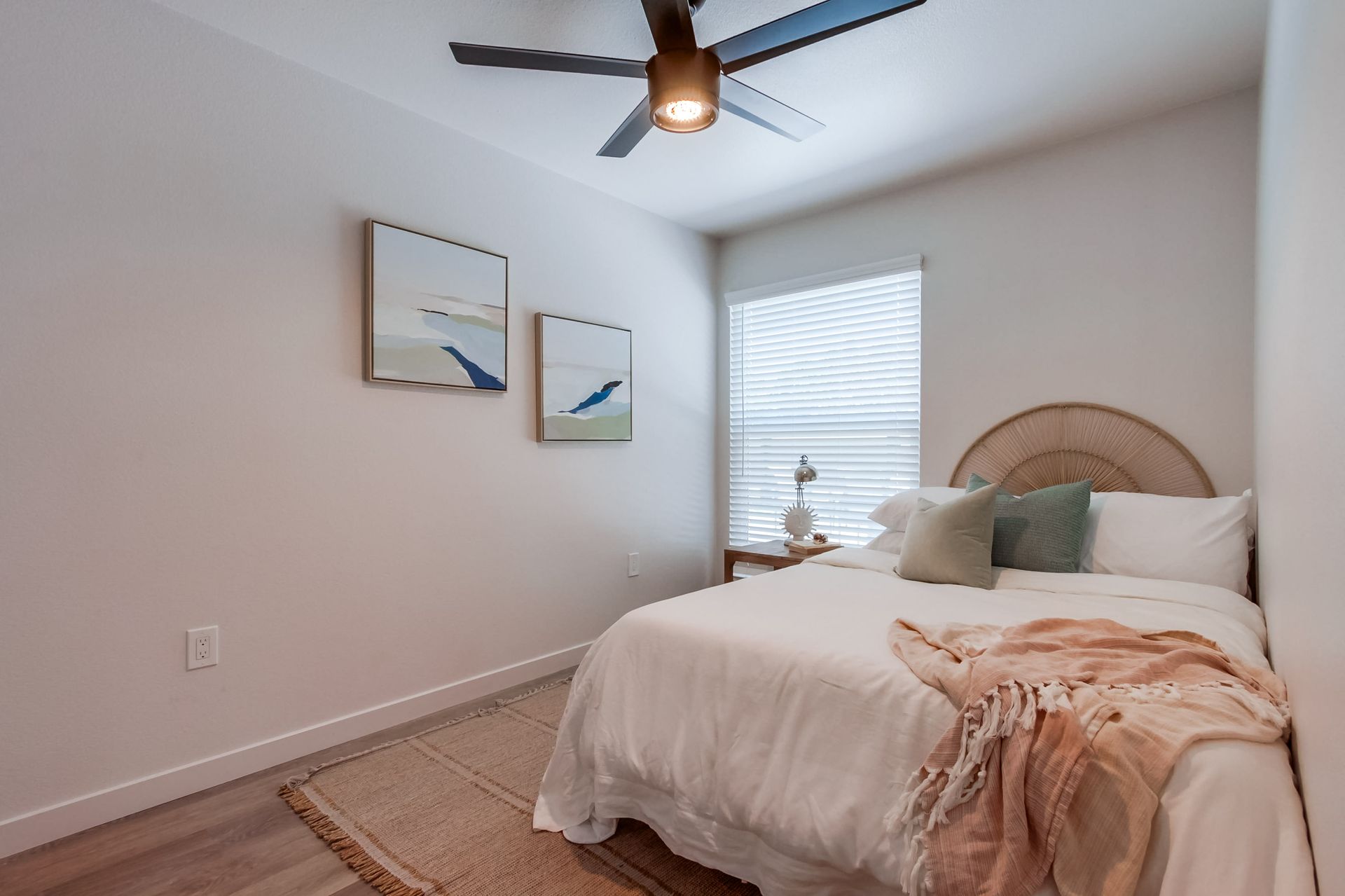 Photo showing a bedroom with an almost square window, but taller than it is wide