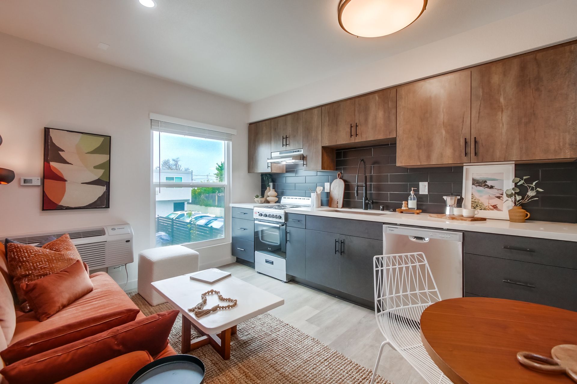 Photo showing a kitchen in a single row, with a wide window next to it