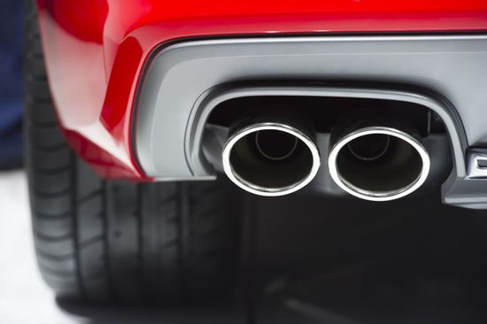 Red Car Exhaust Pipe — Huntsville, AL — Worth Exhaust Center