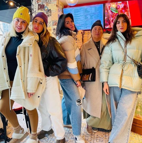 A group of women are posing for a picture together