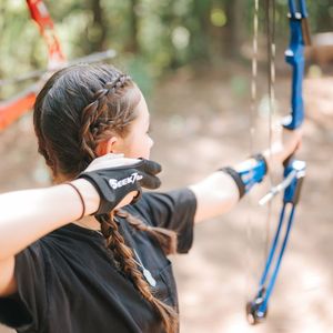 Girl using a Bow in archery